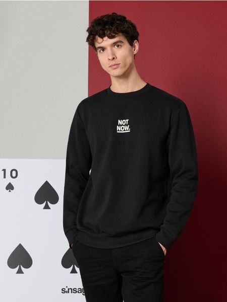 Bluza crewneck z napisem - czarny. Czarne bluzy bez kaptura Sinsay, l, bez wzorów, bez kaptura. W wyprzedaży za 14.99 zł.