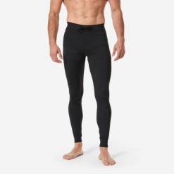 Legginsy UV surfingowe męskie Decathlon 100. Czarne legginsy długie sportowe Decathlon, m, bez wzorów, z dzianiny. Za 69.99 zł.