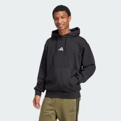 Bluza polarowa Essentials Feelcozy. Czarne bluzy z kapturem Adidas, s, bez wzorów, z bawełny, z kapturem. Za 178.99 zł.