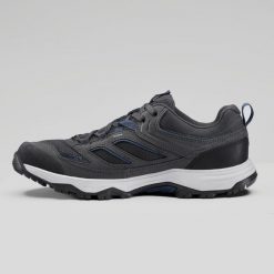 Buty turystyczne męskie Quechua MH100. Niebieskie buty trekkingowe QUECHUA, bez wzorów, z kauczuku, bez zapięcia, trekkingowe. Za 169.99 zł.