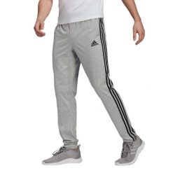 Spodnie męskie adidas Essentials Single. Czarne spodnie materiałowe Adidas, na co dzień, m, bez wzorów, casualowe. Za 121.00 zł.