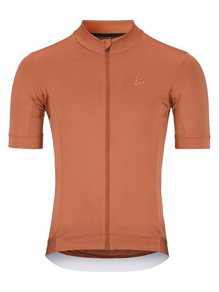 Craft Koszulka kolarska "Essence" w kolorze pomarańczowym rozmiar: S. Pomarańczowe t-shirty sportowe Craft, bez wzorów, z materiału, bez ramiączek, rowerowe. Za 100.52 zł.