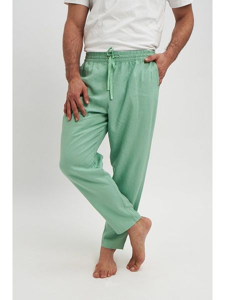 Marks & Spencer Spodnie w kolorze zielonym rozmiar: 42/L31. Zielone spodnie materiałowe Marks & Spencer, l, bez wzorów, z materiału. Za 43.68 zł.