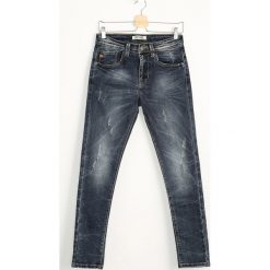 Granatowe Jeansy Steep. Jeansy marki Under Armour. Za 54.99 zł.
