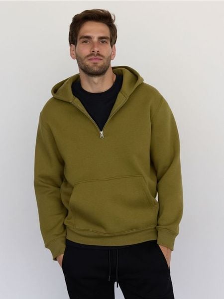 Bawełniana bluza z kapturem - ciemnozielony. Zielone bluzy z kapturem Reserved, l, bez wzorów, z bawełny, z kapturem. W wyprzedaży za 69.99 zł.