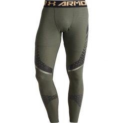 Under Armour ZONAL COMPETITION Legginsy downtown green/black/iridescent foil. Spodnie treningowe długie marki Under Armour, z elastanu. W wyprzedaży za 284.25 zł.