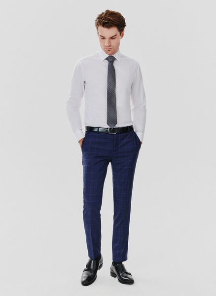 PAKO LORENTE – Granatowe spodnie garniturowe w niebieską kratkę. Niebieskie eleganckie spodnie Pako Lorente, z lycry. Za 299.99 zł.