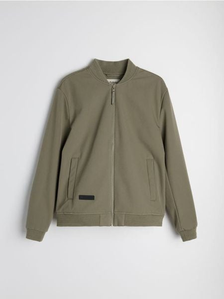 Kurtka softshell bomber - zielony. Zielone kurtki Sinsay, l, bez wzorów, z softshellu, bez kaptura. Za 99.99 zł.