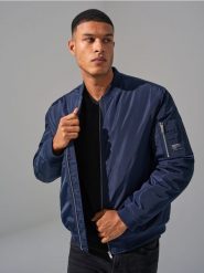 Kurtka bomber - granatowy. Niebieskie kurtki Sinsay, l, bez wzorów, z satyny, bez kaptura. Za 79.99 zł.