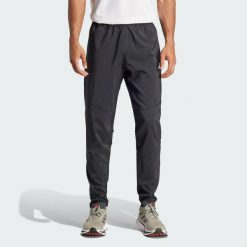 Spodnie Own The Run. Czarne buty do biegania Adidas, bez wzorów, z materiału, bez zapięcia, do biegania. Za 259.00 zł.