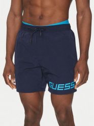 Guess Szorty kąpielowe F5GT12 WH1C2 Granatowy Regular Fit. Niebieskie kąpielówki Guess, m, z aplikacjami, z syntetyku. Za 219.99 zł.