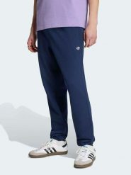 Adidas Spodnie dresowe w kolorze granatowym rozmiar: S. Niebieskie spodnie treningowe długie Adidas, s, bez wzorów, z dresówki. Za 159.95 zł.
