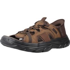 Sandały SKECHERS SLIP-INS REVOLTED SS Brązowy. Brązowe sandały Skechers, z materiału, bez zapięcia. Za 316.99 zł.