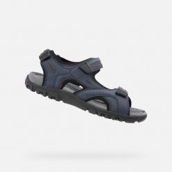Sandales Geox Bleu. Niebieskie buty trekkingowe Geox, bez wzorów, bez zapięcia. Za 338.50 zł.