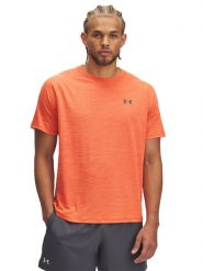 Under Armour Koszulka sportowa "Tech" w kolorze pomarańczowym rozmiar: M. Pomarańczowe t-shirty sportowe Under Armour, bez wzorów, z materiału, bez ramiączek, outdoorowe. Za 106.13 zł.