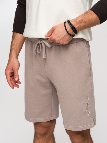 Szorty męskie REGULAR FIT z dzianiny french terry - ciemnobeżowe V2. Brązowe szorty Ombre Clothing, m, z aplikacjami, z bawełny, wizytowe. W wyprzedaży za 104.99 zł.