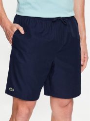 Lacoste Szorty tenisowe GH353T Granatowy Regular Fit. Niebieskie krótkie spodenki sportowe LACOSTE, m, bez wzorów, z syntetyku. Za 269.99 zł.
