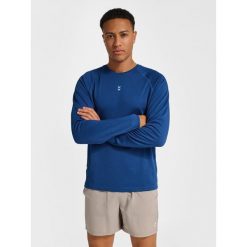 Koszulka z długim rękawem Hummel Pulse Performance. Niebieskie koszulki z długim rękawem Hummel, bez wzorów, bez ramiączek, na fitness i siłownię. Za 175.00 zł.