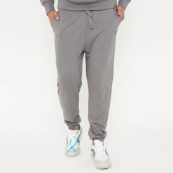 Spodnie sportowe unisex F BALLON szare. Szare spodnie treningowe długie Legea, bez wzorów, z gumy. W wyprzedaży za 92.00 zł.