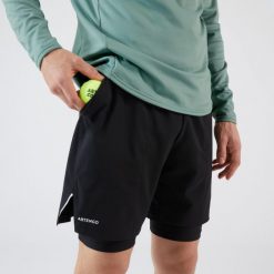Spodenki do tenisa 2w1 męskie Artengo Thermic. Czarne krótkie spodenki sportowe ARTENGO, l, bez wzorów. Za 79.99 zł.