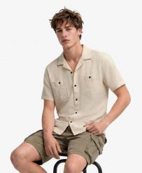Superdry Koszula krótki rękaw The Merchant Store z fakturowanej bawełny. Brązowe koszule Superdry, m, bez wzorów, z bawełny, bez kołnierzyka, bez ramiączek. Za 336.50 zł.