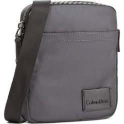 Saszetka CALVIN KLEIN - Ease Mini Reporter K50K503467 009. Saszetki i nerki marki CALVIN KLEIN. W wyprzedaży za 249.00 zł.