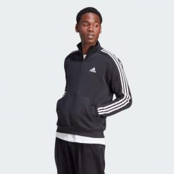 Bluza Essentials Fleece 3-Stripes 1/4-Zip. Czarne bluzy Adidas, s, bez wzorów, z materiału, bez kaptura. Za 223.99 zł.