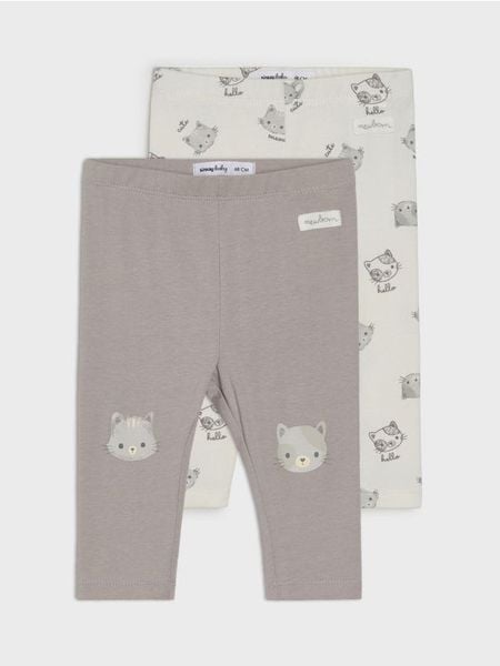 Bawełniane legginsy z motywem kotów - kremowy. Białe legginsy długie sportowe Sinsay, l, bez wzorów, z bawełny. W wyprzedaży za 15.99 zł.