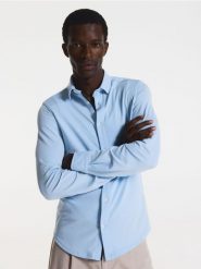 Koszula slim fit w paski - jasnoniebieski. Niebieskie koszule Reserved, l, bez wzorów, z tkaniny, bez kołnierzyka, bez ramiączek. W wyprzedaży za 59.99 zł.