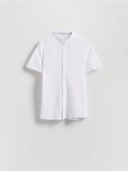 Koszula super slim fit ze stójką - biały. Białe koszule Reserved, l, bez wzorów, z bawełny, bez kołnierzyka, bez ramiączek. Za 79.99 zł.