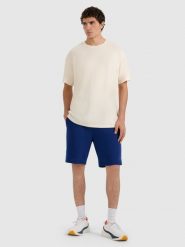 4F Spodenki dresowe regular męskie - granatowe S. Niebieskie krótkie spodenki sportowe 4F, l, bez wzorów, z bawełny. Za 79.99 zł.