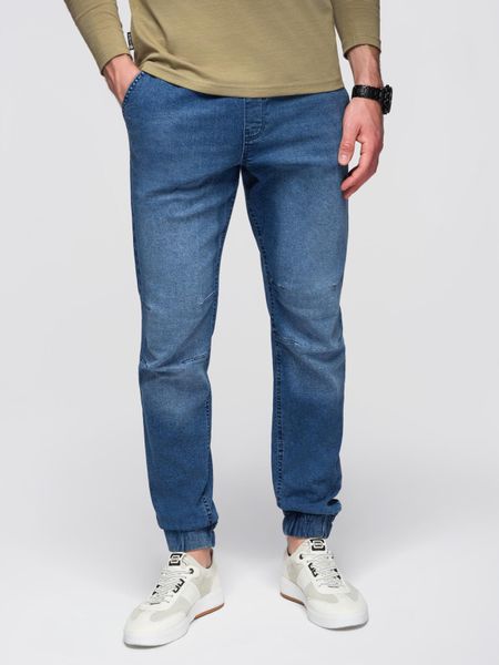 Męskie spodnie JOGGERY jeansowe z efektem sprania - niebieskie V2 - Rozmiar: S. Niebieskie joggery i bojówki Ombre Clothing, l, z aplikacjami, z bawełny, eleganckie. W wyprzedaży za 155.99 zł.