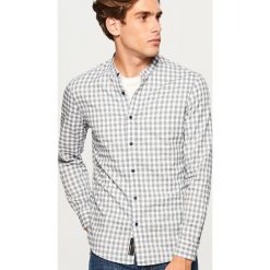 Koszula slim fit z bawełny organicznej - Niebieski. Koszule marki Under Armour. Za 99.99 zł.