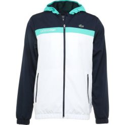 Lacoste Sport TENNIS JACKET Kurtka sportowa navy blue/white/papeete. Kurtki treningowe marki 4F. Za 629.00 zł.