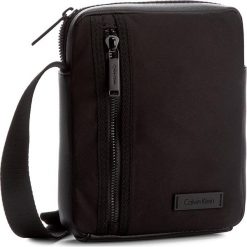 Saszetka CALVIN KLEIN BLACK LABEL - Adam Nylon Mini Repo K50K503162 001. Saszetki i nerki marki Calvin Klein Black Label. W wyprzedaży za 239.00 zł.