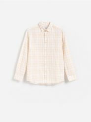 Bawełniana koszula regular fit - żółty. Żółte koszule Reserved, l, bez wzorów, z bawełny, bez kołnierzyka, bez ramiączek. Za 119.99 zł.