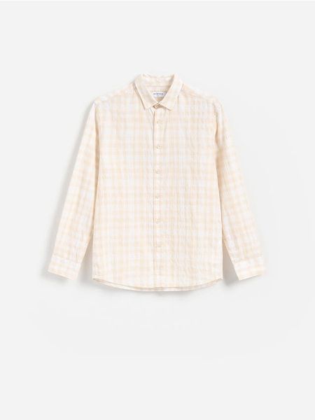 Bawełniana koszula regular fit - żółty. Żółte koszule Reserved, l, bez wzorów, z bawełny, bez kołnierzyka, bez ramiączek. Za 119.99 zł.