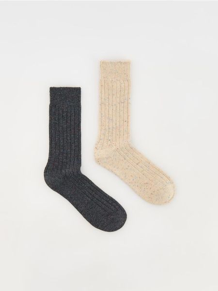 2 pack skarpet z wełną - żółty. Żółte skarpety Reserved, bez wzorów, z wełny. W wyprzedaży za 22.99 zł.