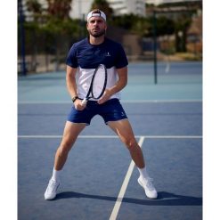 Koszulka sportowa męska Performance. Białe t-shirty sportowe NORDICDOTS, bez wzorów, z elastanu, bez ramiączek. Za 230.00 zł.