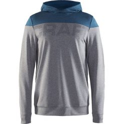 Bluza w kolorze szaro-niebieskim. Bluzy z kapturem marki Craft. W wyprzedaży za 130.95 zł.