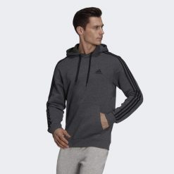 Bluza męska adidas Essentials Fleece 3-Stripes Hoodie. Czarne bluzy z kapturem Adidas, m, bez wzorów, z bawełny, z kapturem. Za 194.00 zł.