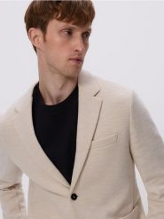 Dzianinowa marynarka slim fit - beżowy. Brązowe garnitury Reserved, l, bez wzorów, z bawełny. Za 199.99 zł.