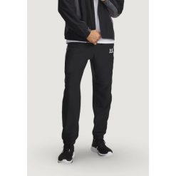 Spodnie Mężczyzna UNDER ARMOUR UA TECH SPORT PANT. Czarne spodnie treningowe długie Under Armour, m, bez wzorów. Za 336.30 zł.