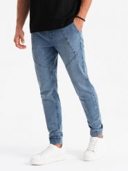 Męskie joggery jeansowe z asymetrycznymi przeszyciami – niebieskie V2 OM-PADJ-0165 - XL. Niebieskie joggery i bojówki Ombre Clothing, na co dzień, l, z aplikacjami, z bawełny, casualowe. Za 113.99 zł.