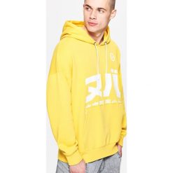 Bluza w żółtym kolorze z kapturem - Zielony. Bluzy marki Cropp. W wyprzedaży za 49.99 zł.