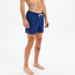 Spodenki surfingowe męskie Olaian Hendaia NT. Niebieskie odzież kąpielowa OLAIAN, l, bez wzorów, z materiału, sportowe. Za 19.99 zł.
