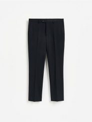 Spodnie garniturowe slim fit - granatowy. Niebieskie garnitury Reserved, l, bez wzorów, z tkaniny. Za 169.99 zł.