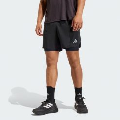 Shorty adi365 Running Essentials 2w1. Białe buty do biegania Adidas, bez wzorów, bez zapięcia, do biegania. Za 179.00 zł.