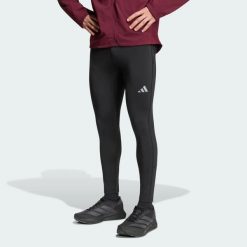 Legginsy adi365 Running Essentials Winterized. Czarne legginsy długie sportowe Adidas, l, bez wzorów, z dzianiny, do biegania, ClimaWarm (Adidas). Za 259.00 zł.