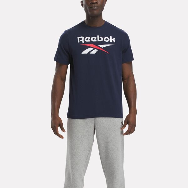 Koszulka fitness męska Reebok krótki rękaw. Niebieskie bluzki z długim rękawem Reebok, m, bez wzorów, z bawełny, bez kołnierzyka, bez ramiączek. W wyprzedaży za 59.99 zł.